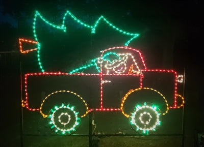 Animated Elf in Truck with Christmas Tree